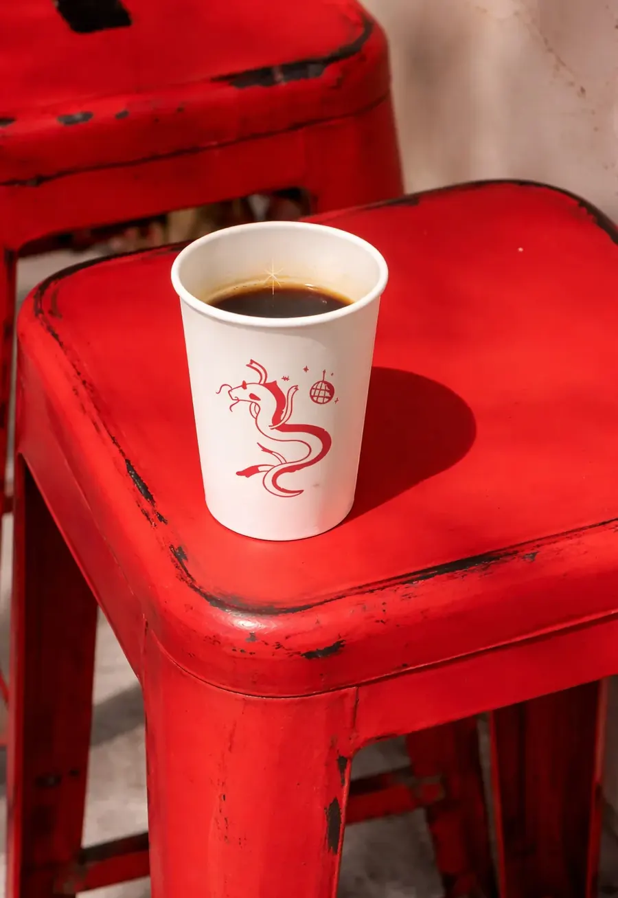 Vietnamese phin filter brewing coffee on a cup